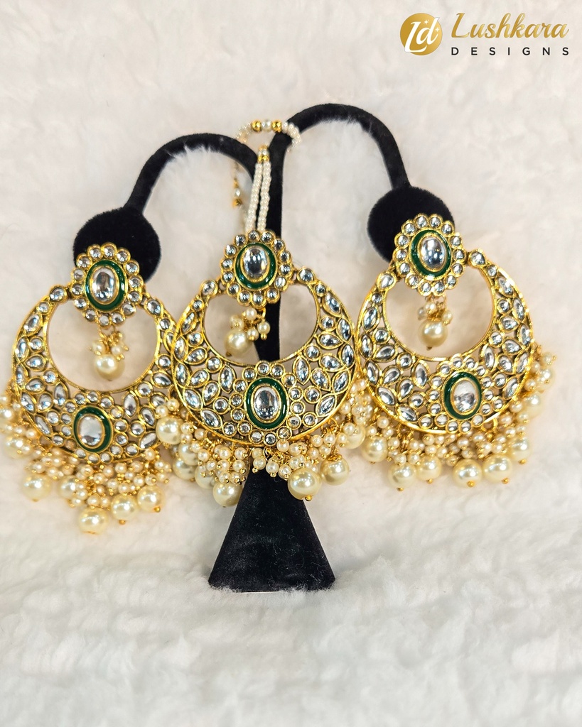 Lushkara Gold-Toned Kundan Jhumka Earrings with Green Stone and Pearl Accents Maang Tikka Set