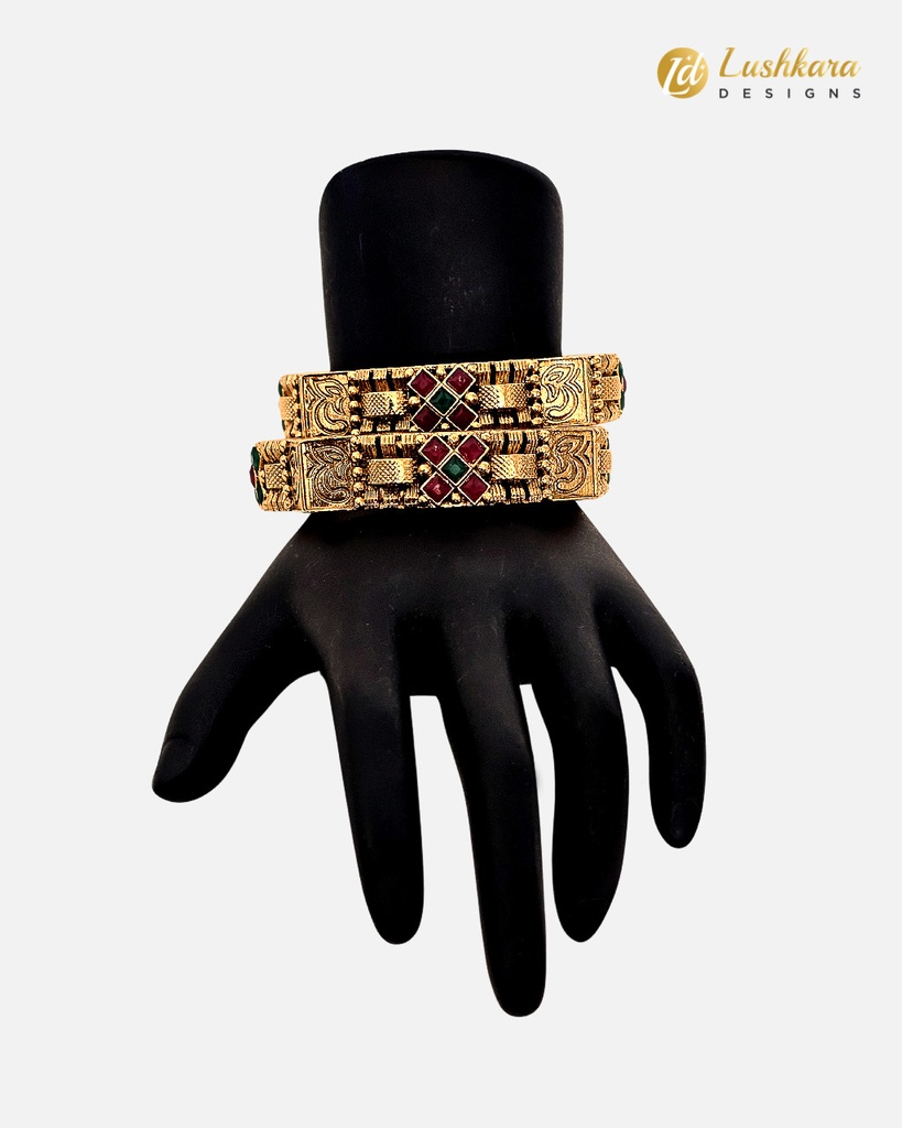 Lushkara Gold Bangle With X Shape Green and Red Stone