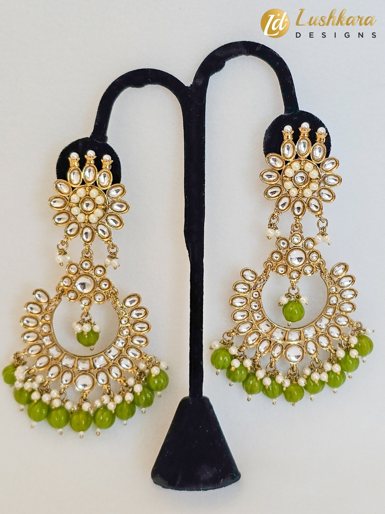 Lushkara Gold-Toned Kundan Jhumka Earrings with Green Bead Accents