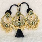 Lushkara Gold-Toned Kundan Jhumka Earrings with Green Stone and Pearl Accents Maang Tikka Set