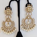Lushkara Gold-Toned Kundan Jhumka Earrings with White Pearl Accents