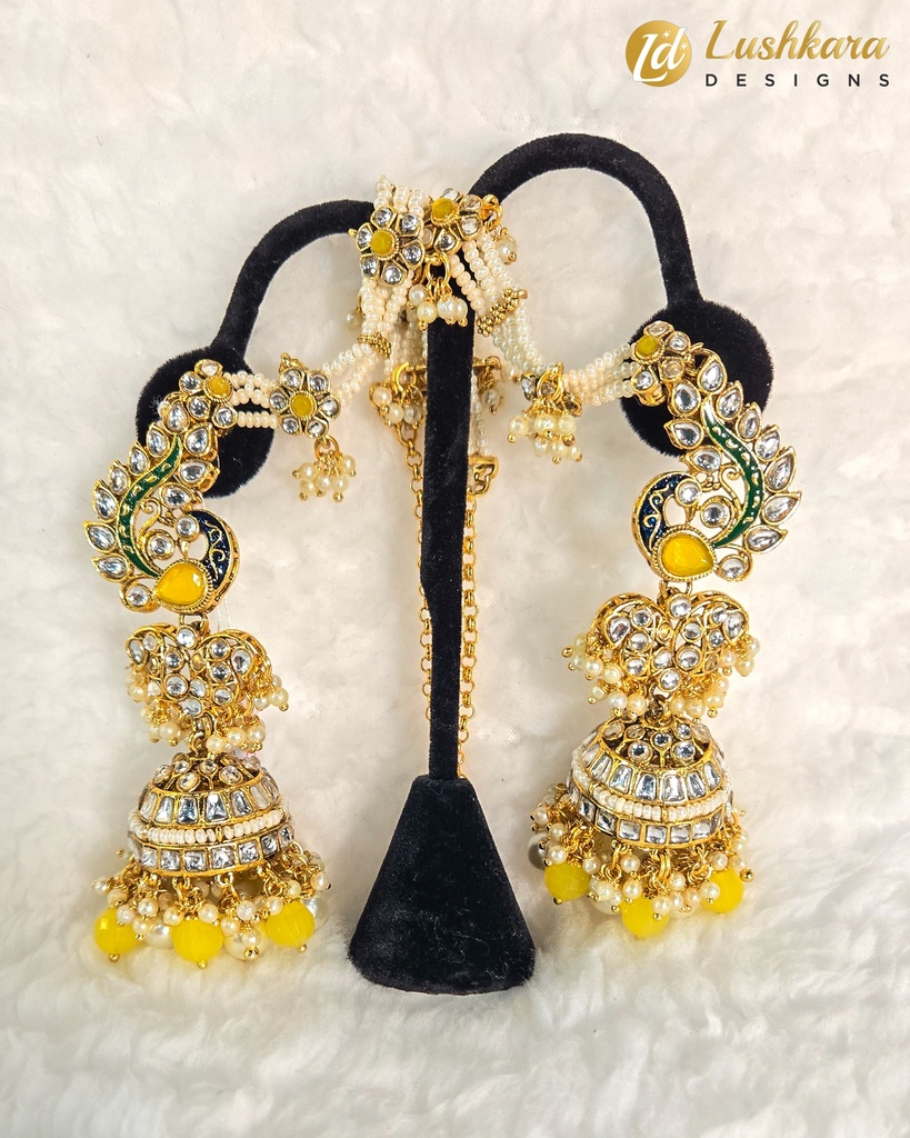 Lushkara Gold-Toned Peacock Kundan Jhumka Earrings with Yellow Bead Accents and Maang Tikka Set