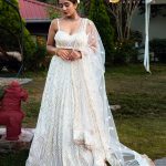 Lushkara White Heavy Sequined Lehenga with Sleveless Blouse and Heavy Latkans and Dupatta