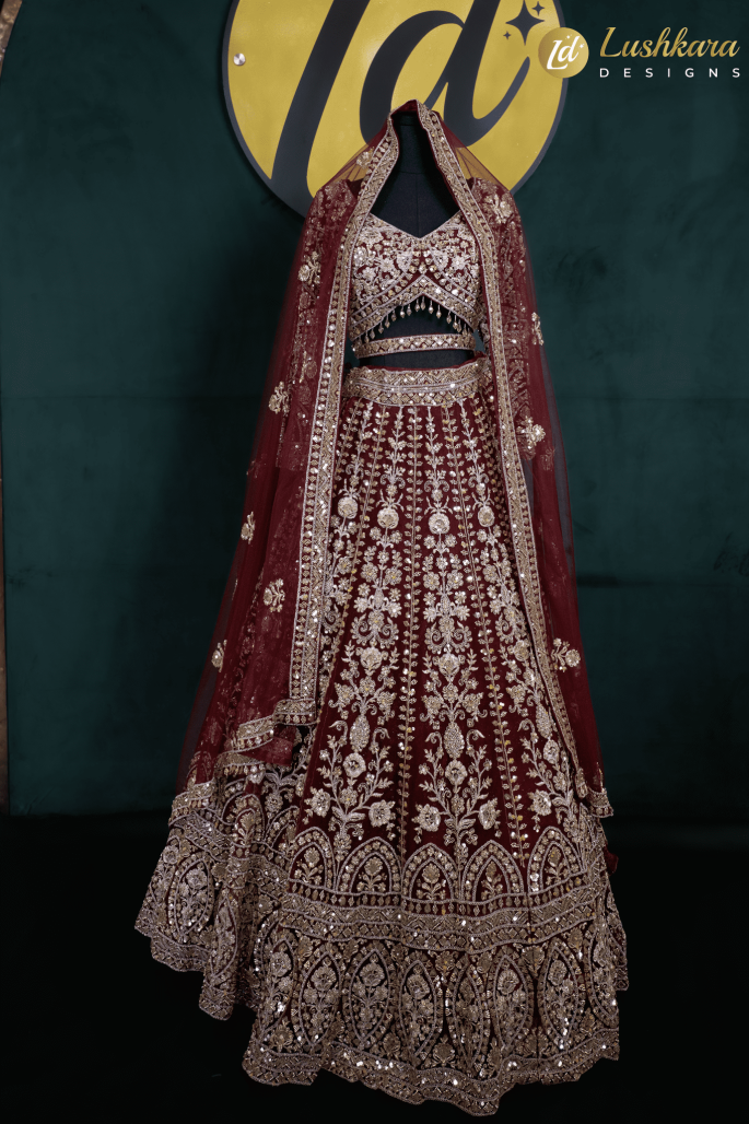 Lushkara Deep Red Bridal Lehenga with Heavy Zardozi and Mirror Work