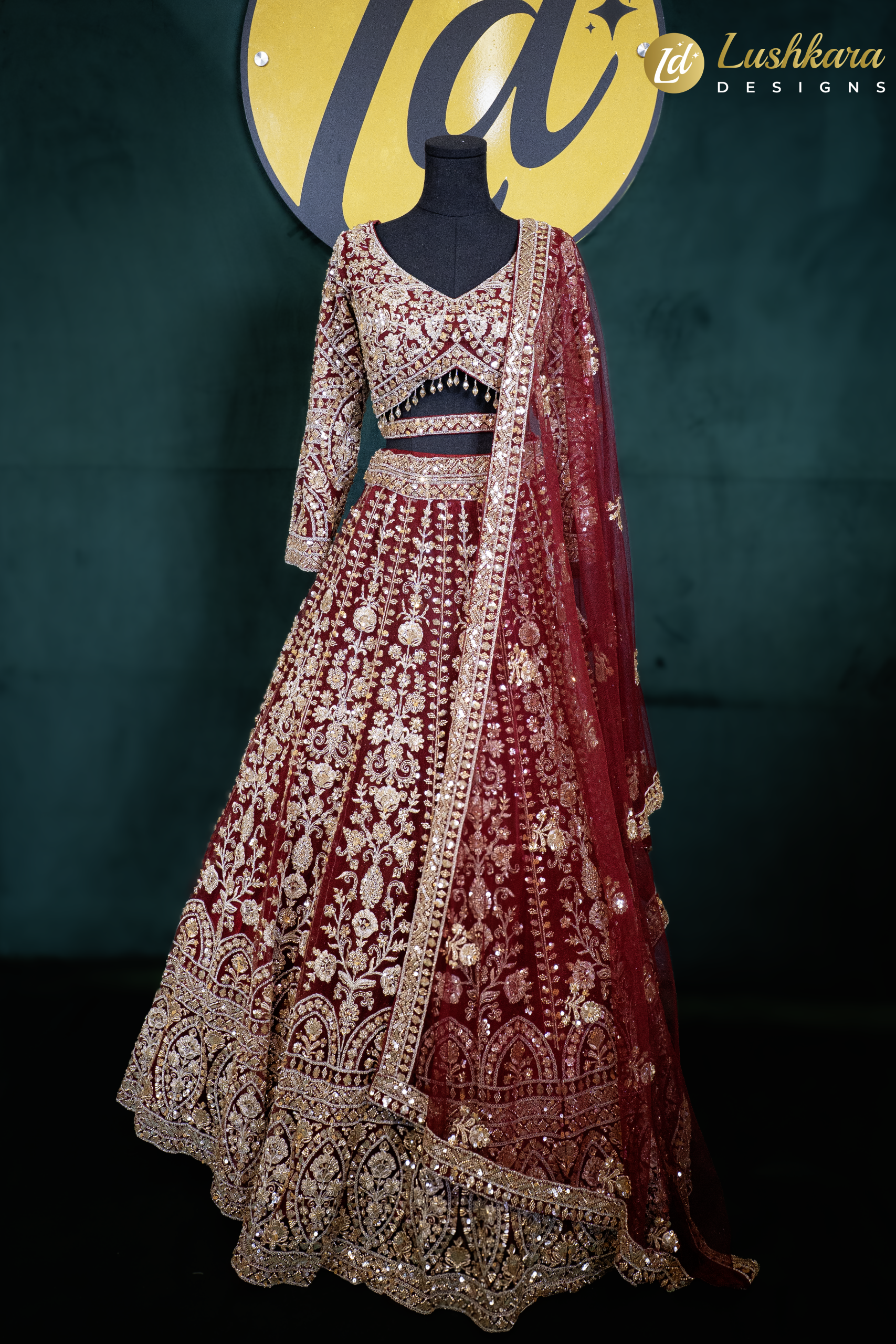 Lushkara Deep Red Bridal Lehenga with Heavy Zardozi and Mirror Work