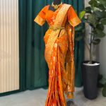 Lushkara Orange Banarasi Saree with Golden Zari & Floral Motifs