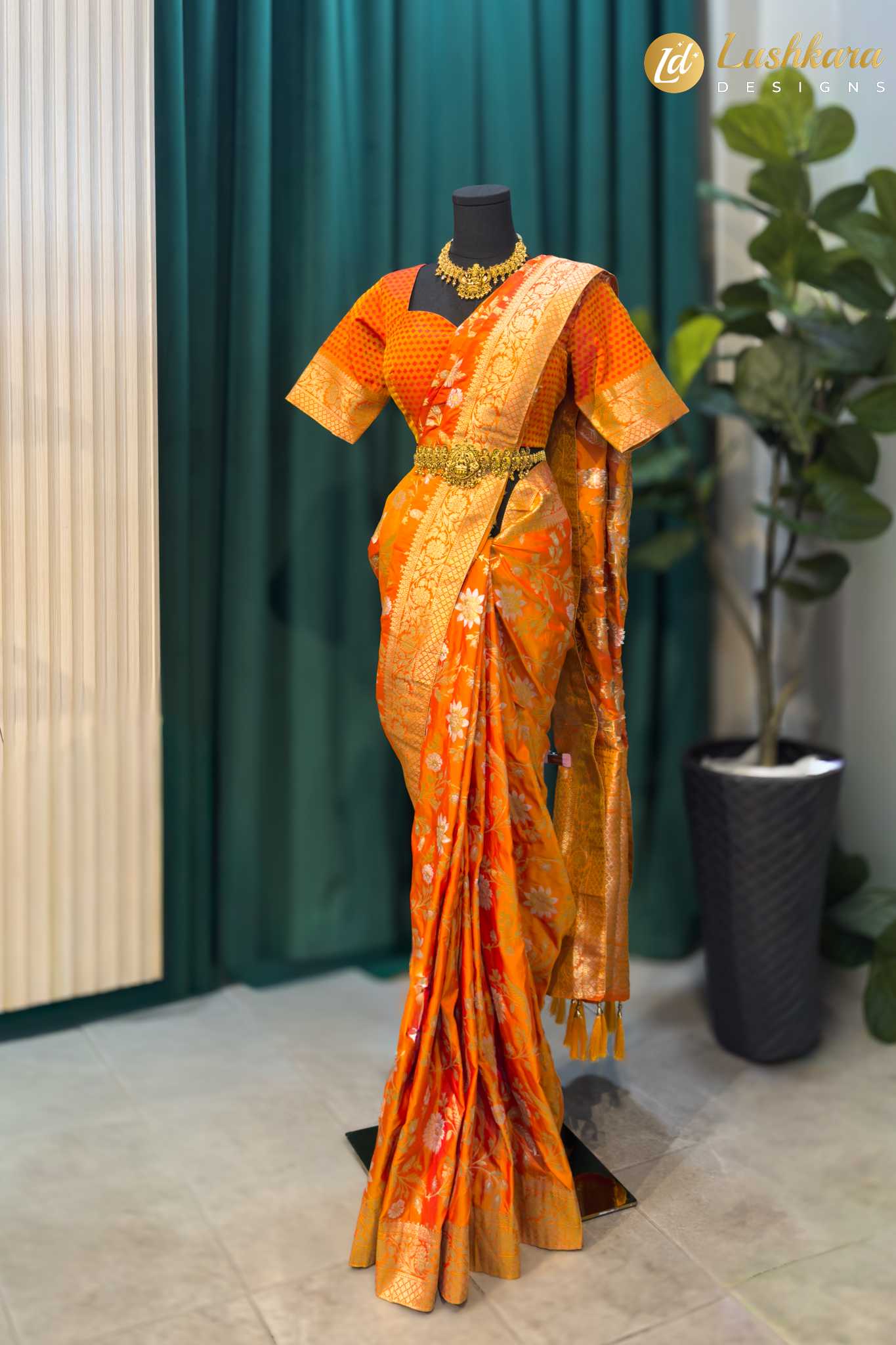 Lushkara Orange Banarasi Saree with Golden Zari & Floral Motifs