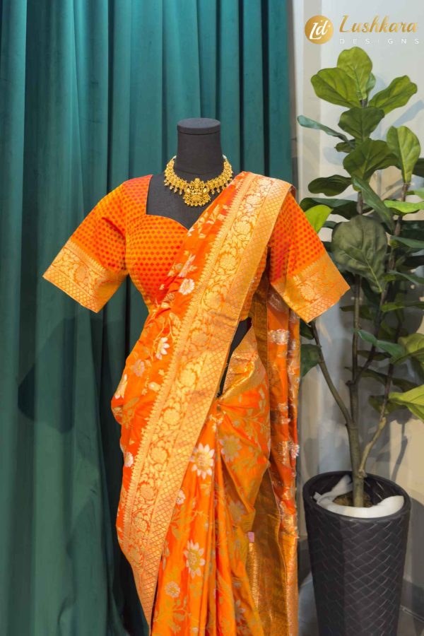 Lushkara Orange Banarasi Saree with Golden Zari & Floral Motifs