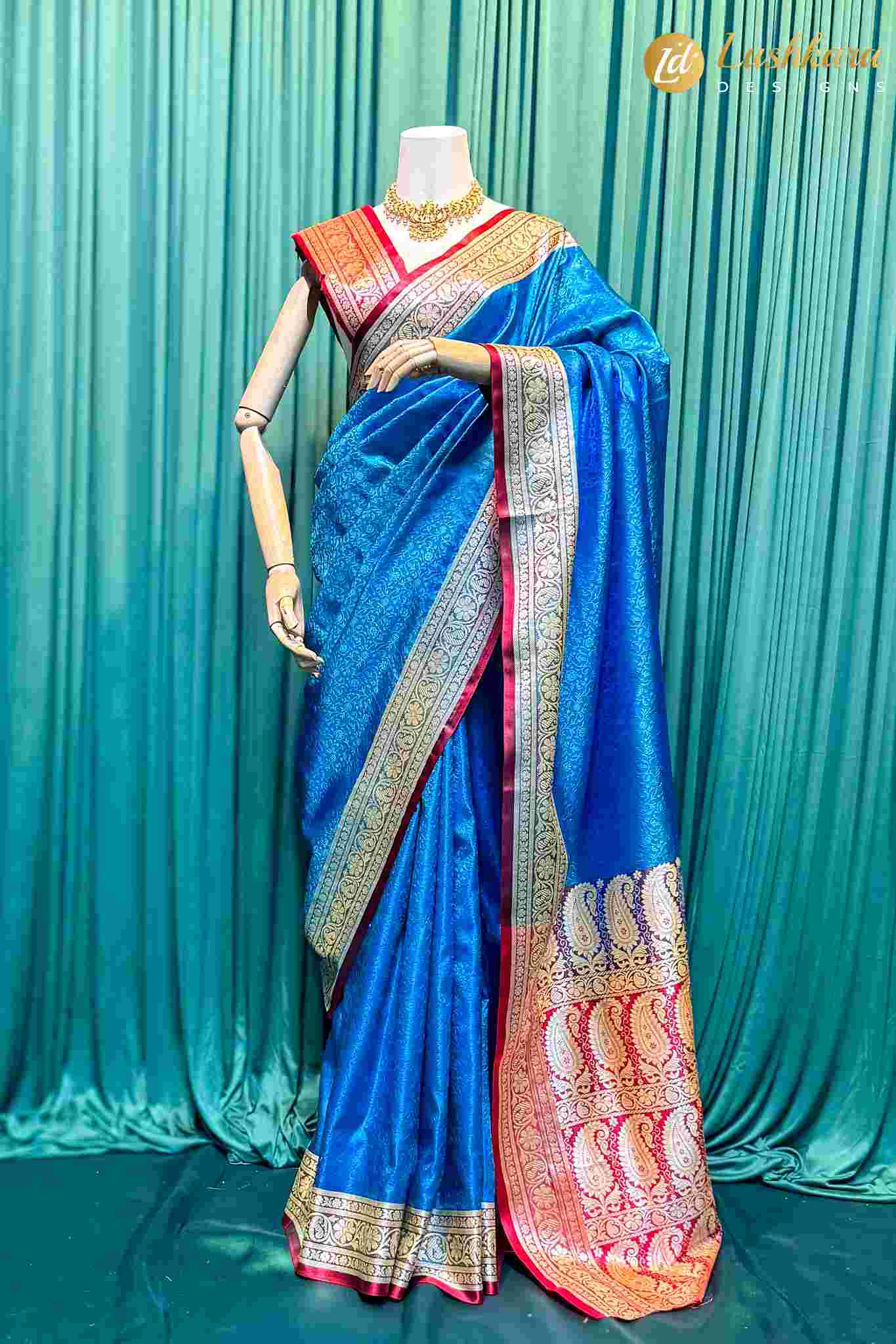 Lushkara Royal Blue Banarasi Silk Saree with Red Border