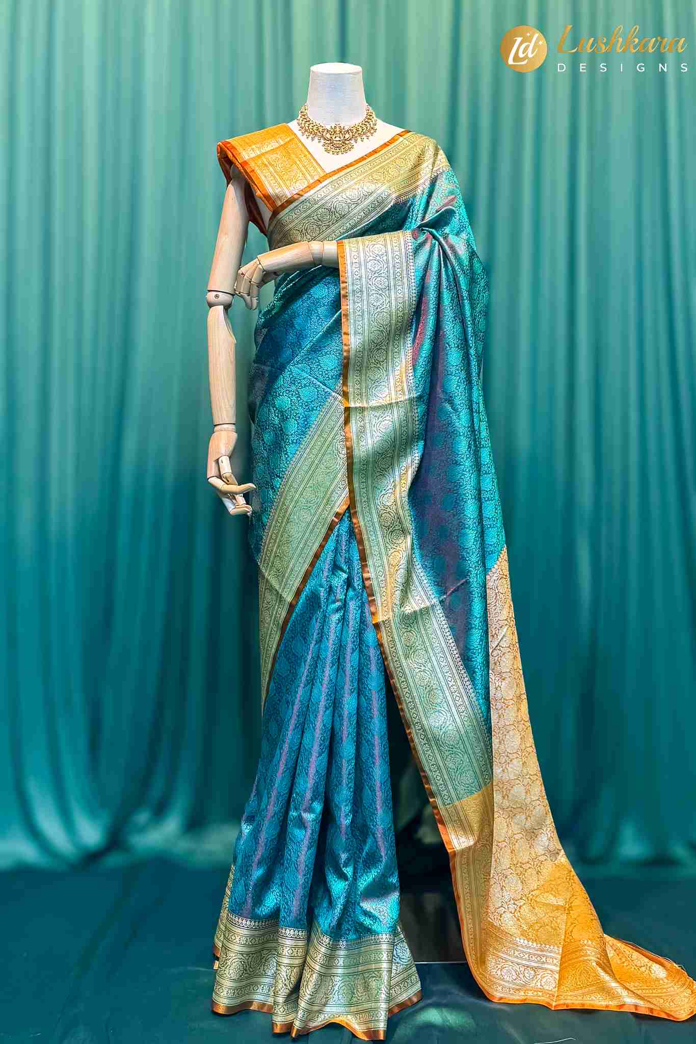 Lushkara Teal Banarasi Silk Saree with Golden Border
