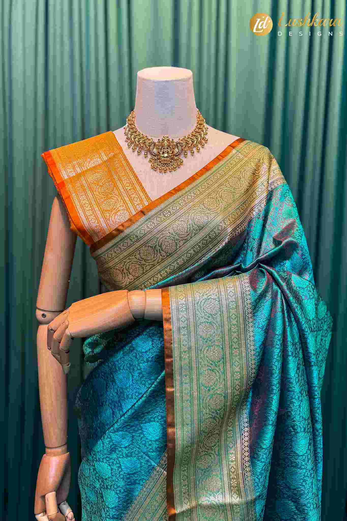 Lushkara Teal Banarasi Silk Saree with Golden Border