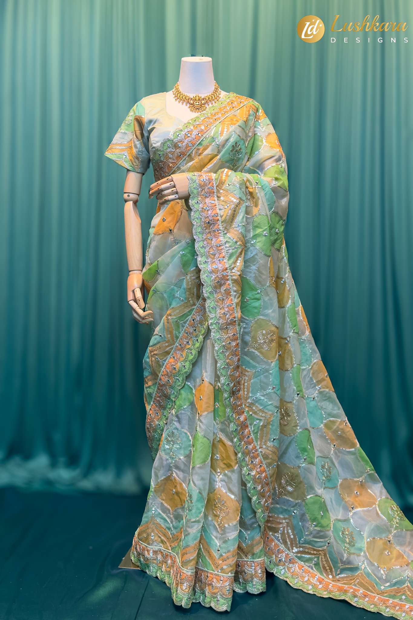 Lushkara Pastel Green & Peach Organza Saree with Mirror Work
