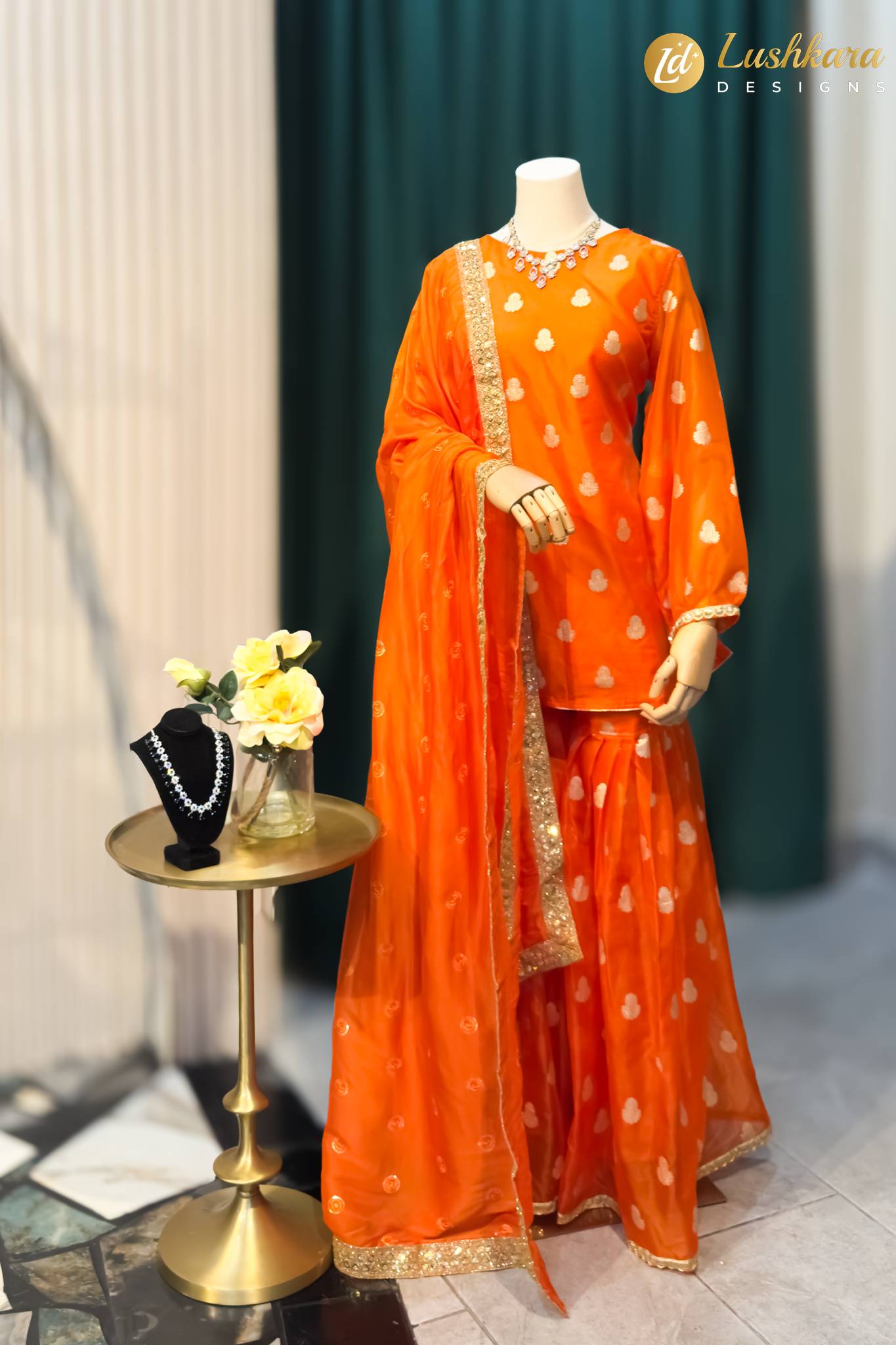 Lushkara Bright Orange Sharara Set with Gold Detailing