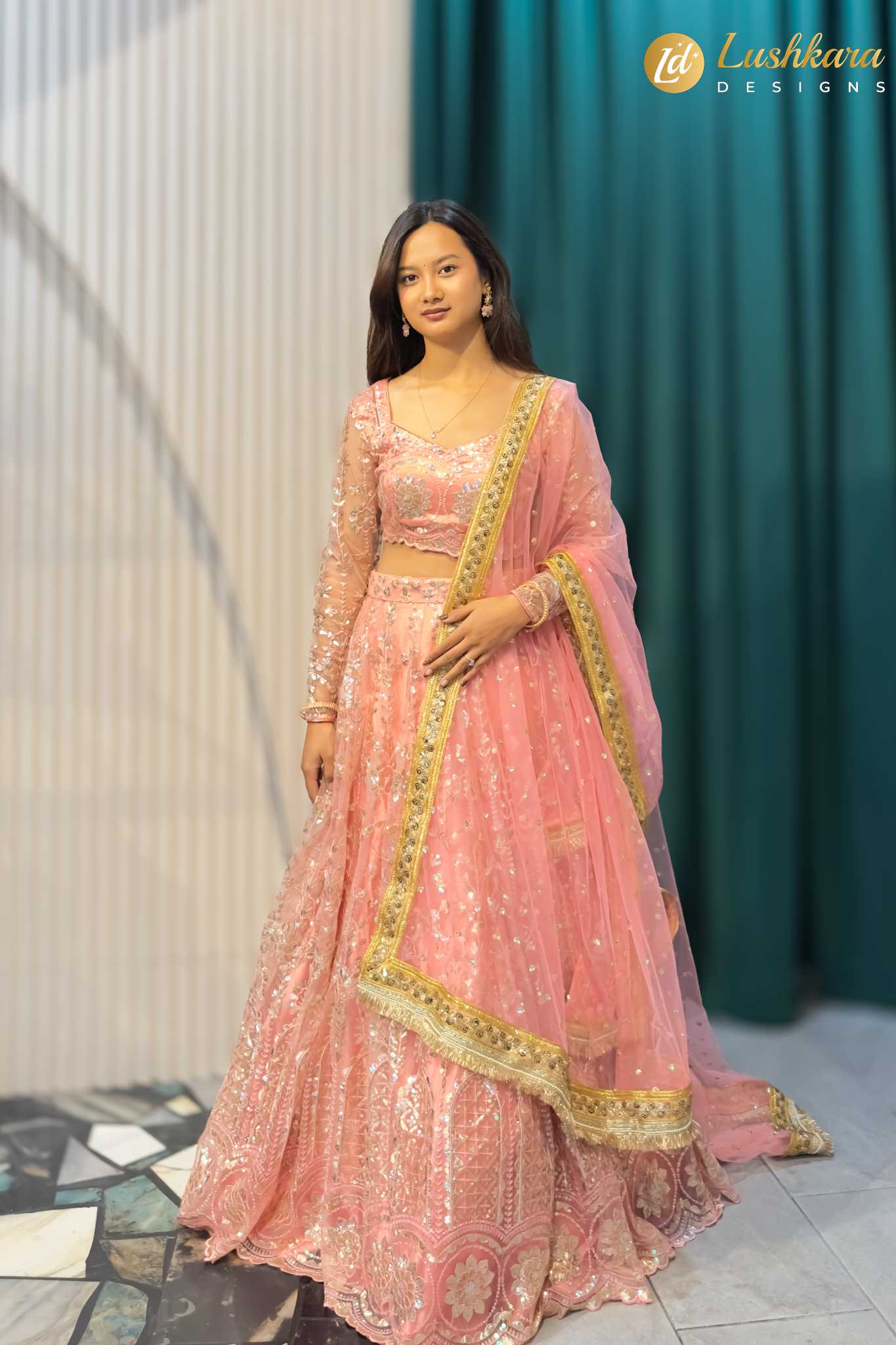 Lushkara Pink Heavy Embroidered Net Lehenga