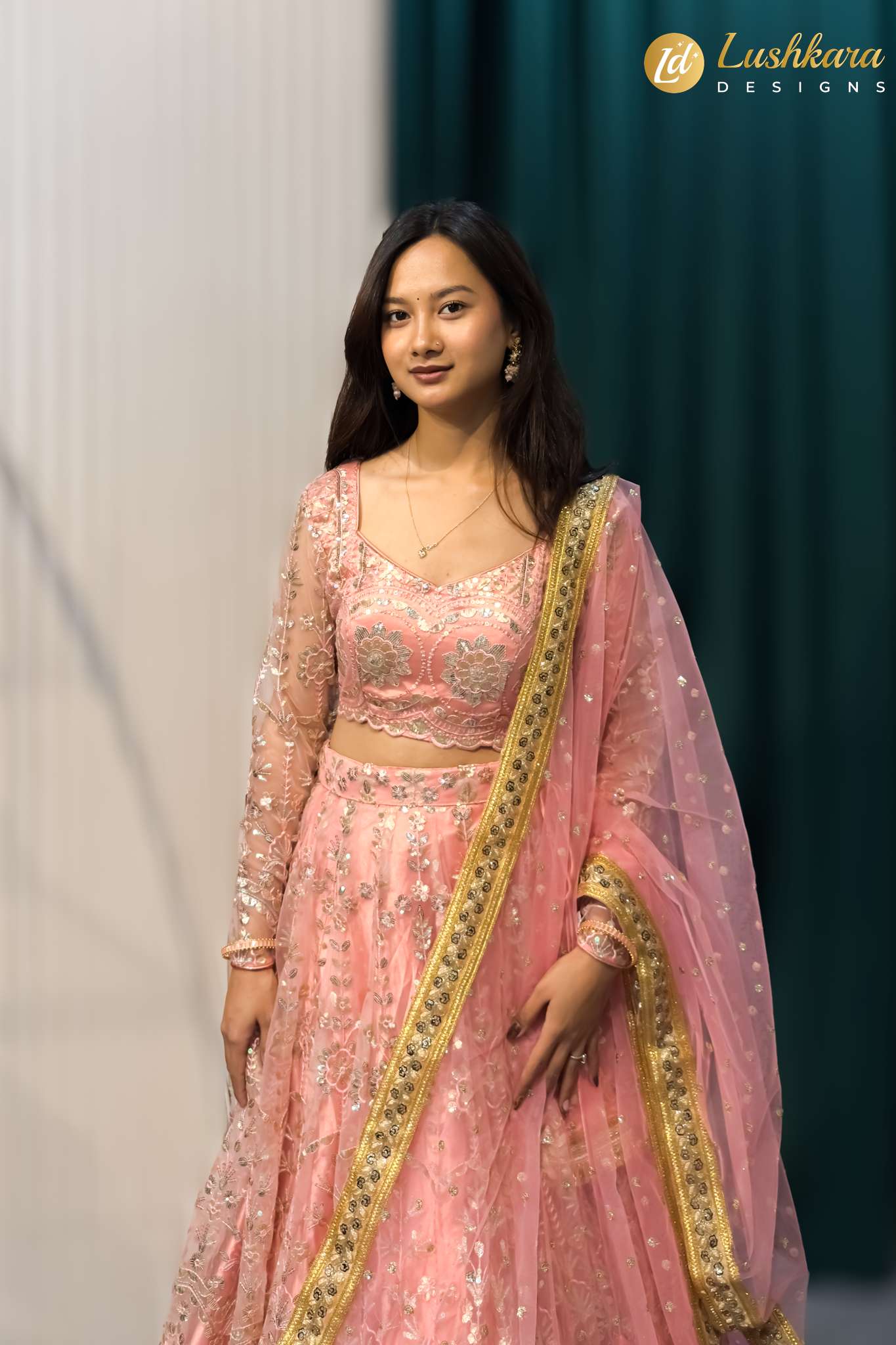 Lushkara Pink Heavy Embroidered Net Lehenga